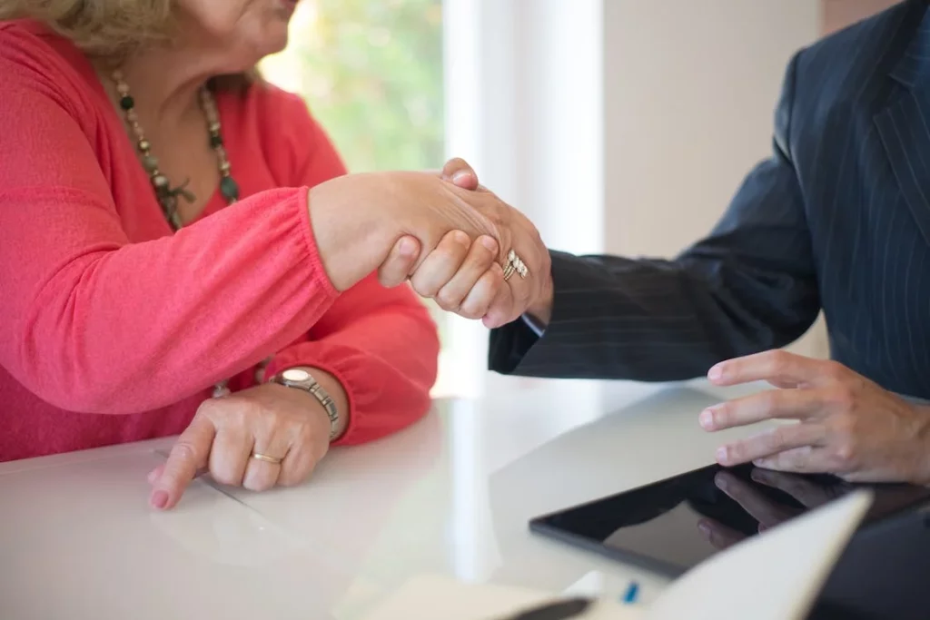 Picture of people shaking hands as an estate planning attorney builds an estate planning strategy