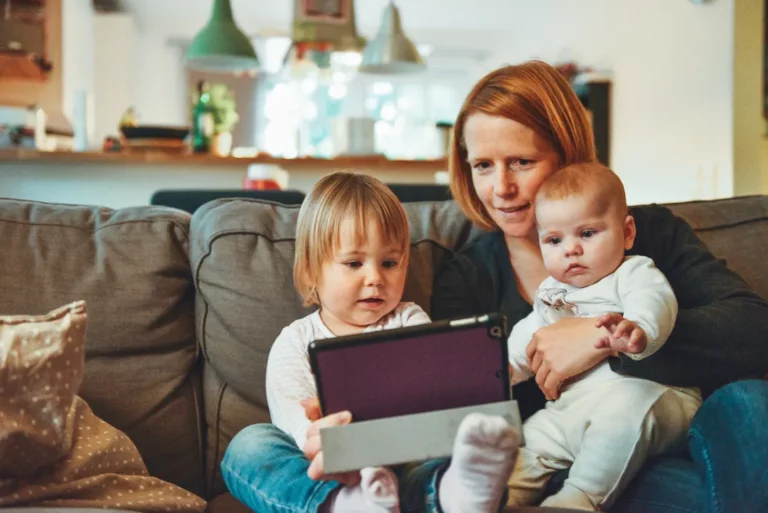 A picture of a mom with two children. The mother is wondering how she can celebrate the holidays after a divorce this year.