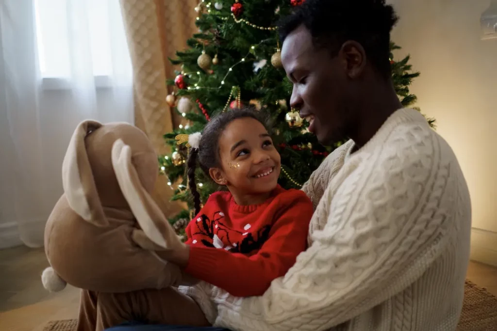 Picture of a girl and her father who is navigating the holidays after divorce.