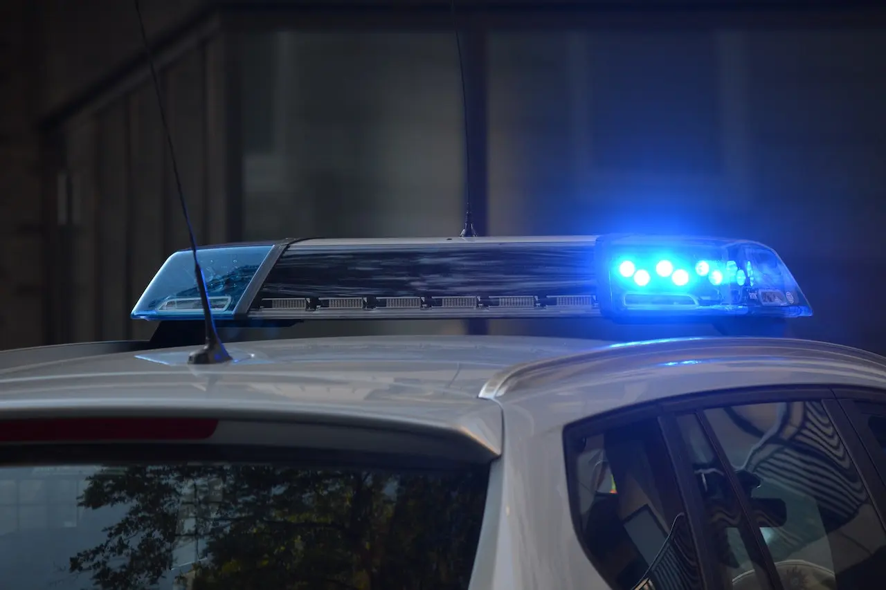 Picture of a cop car and flashing lights for the page about Fayetteville criminal defense attorneys.