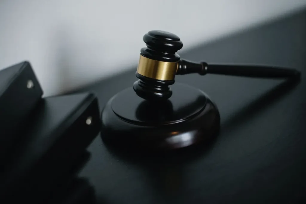 Picture of a judge's gavel on a desk for civil litigation trials.