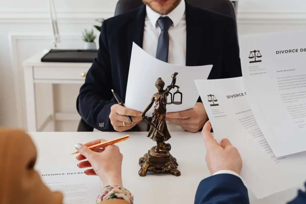 Picture of a couple working with a divorce lawyer learning how to get a divorce in North Carolina.