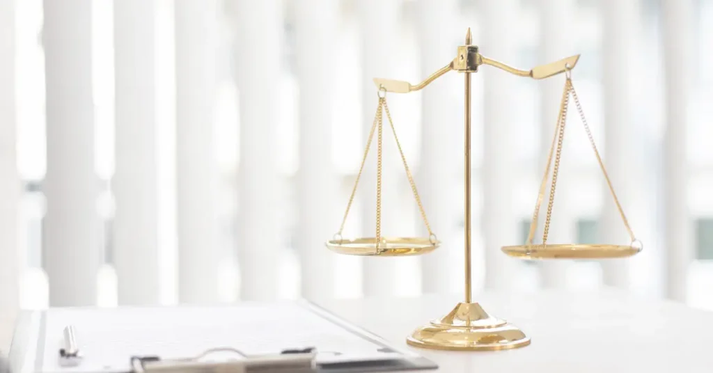 Picture of a desk with balanced scales sitting on it for the Pro Bono Expunction Clinic in Moore County, North Carolina.