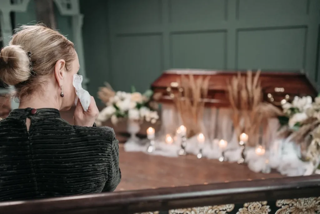 Picture of a woman at a funeral for the blog about wrongful death lawsuit.