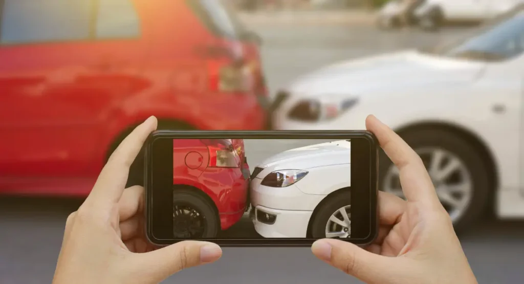 Picture of someone taking a picture of a car accident in North Carolina.