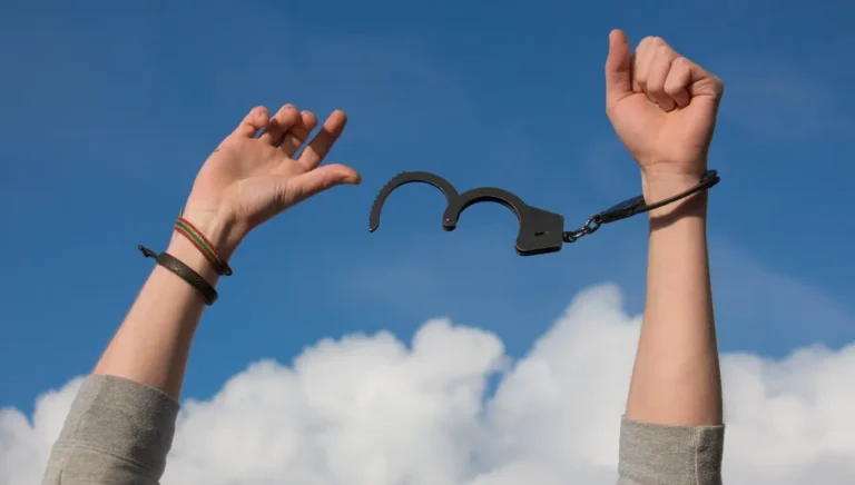 Picture of a person breaking free of handcuffs after learning about prayer for judgement